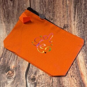 NEW Orange Zippered Pouch with Leo Design and Charm Item #PHK3493